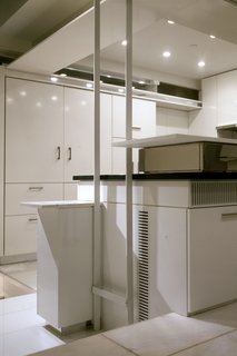 The chef's kitchen includes a Gaggenau six-burner stove, a Bosch dishwasher, and two Subzero refrigerators. 
