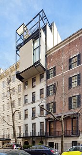 With four levels and five private terraces, the penthouse cantilevers over Beekman Place in Manhattan. 