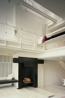 One of the highlights is the sleek, wood-burning fireplace. 