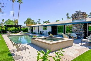 A new spa and a fully remodeled pool entertain guests outdoors.