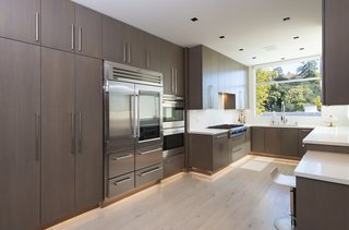 The updated chef's kitchen is bright and designed with lots of storage space to help maintain its streamlined modern look.