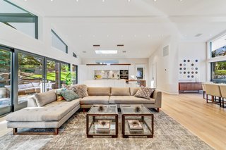 Sliding glass doors open to a private rear garden for indoor/outdoor entertaining during the warmer months.
