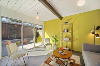 The renovation installed modern aluminum double-pane sliding doors.