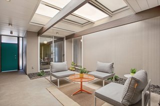 The central atrium has a strong indoor/outdoor feel. An operable cover can close the area off to the elements.