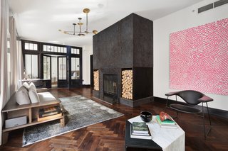 Rich walnut herringbone parquet floors are complemented by meticulous millwork. 