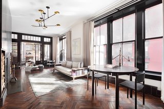 The baseboards, casings, windows, and doors are trimmed in Roman & Williams’ favorite high gloss black oil paint by Fine Paints of Europe. 