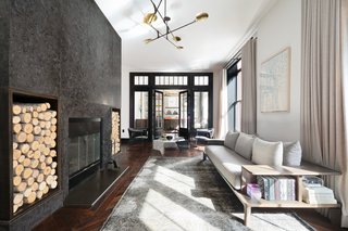 The dramatic, flamed granite, wood-burning fireplace is the focal point of the living room which is divided into three distinct sitting areas. 