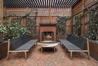 An expansive outdoor terrace—especially one with a wood-burning fireplace is a rare find in a downtown Manhattan full-service building. 