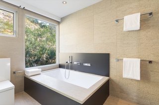 The master bath has an elegant soaking tub.