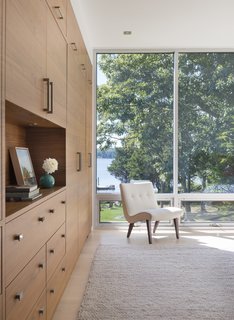 9 Marvelous Waterfront Homes - Photo 6 of 10 - Built on a gentle slope on the Westport River, less than a mile from the coast in southeastern Massachusetts is an unabashedly modern glass house designed for a well known Cambridge general contractor and his wife. Mature oaks and cedars define the property edges and frame dramatic sunset and island views. 