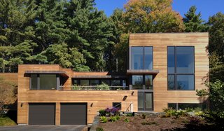 10 Prefabs Found on the East Coast - Photo 8 of 10 - While the homeowners initially hoped to renovate and add on to their original home, a review of multiple renovation strategies revealed that it would be less expensive and less time-consuming to start from scratch and use a custom-designed prefab.