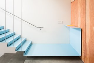  Tucked away just east of Vancouver’s Railtown district is the office of Burnkit, a creative agency that values the importance of a well-designed workspace. The staircase has a floating metal landing that connects to a fir plywood wall.