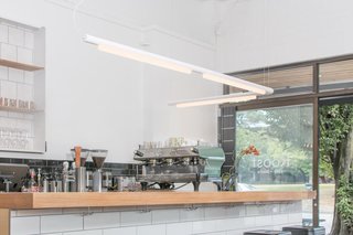 Pipeline — Design, Caine Heintzman<br><br> The Pipeline’s modular design allows endless shaping possibilities. It has a dimmable, linear LED bulb housed in either a black, white, polished aluminum, or copper finish.