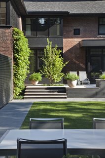 A modern brick home with an incredible backyard.