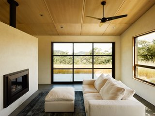 Neutral furnishings and gray floors don't distract from the views.