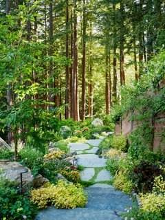 A winding path connects the two south-facing structures. 