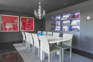 An Austin Airbnb Is a Blissful Getaway - Photo 4 of 7 - The dining room features built-ins set against a lavender backdrop and artwork by Argentine artist Cristina Fresca. The residents discovered the pieces at a modern art fair in Buenos Aires and shipped them home to Texas.