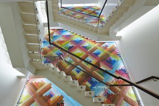 The mural measures roughly 39 feet high by 16 feet wide, its colorful tessellation the backdrop against which other architectural elements cohere. 