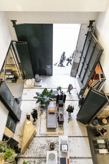 A bird’s eye view reveals how the once utilitarian space has been transformed into a gallery setting.