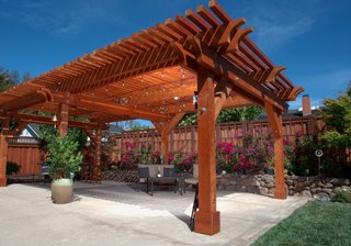 A versatile material, redwood can be left to turn a rustic, silver-tone gray, or finished to take on a glowing tint. A pergola such as this one, which will accompany Humboldt Redwood Company at Dwell on Design, can imbue your backyard space with both stateliness and charm.