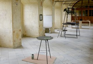Over time, the circular motion of a pendulum on the flat surface creates a bowl.