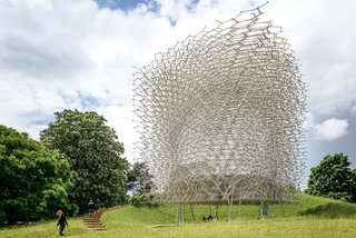 To create the Hive, Wolfgang Buttress collaborated with structural engineers Simmonds Studio and physicist Dr. Martin Bencsik in addition to a team of audio, visual, and lighting designers. Landscape architects BDP envisioned a meadow filled with native plants that would attract the garden's bees to thenusher guests into the structure. 