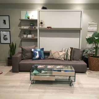 Online interior design company Decorist furnished the home to reflect a laid-back, Southern Californian lifestyle. Paintings by San Diego artist and Design Milk founder Jaime Derringer livened up the walls.