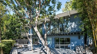 The house sits on a 10,414-square-foot double lot with plenty of outdoor living space. A vegetable garden and an orchard with five varieties of fruit trees flourish on the site.