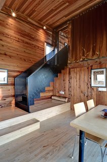 Natural cedar lines the interior of Hirtles, which was upgraded to include a second bathroom and a jacuzzi tub that looks out onto the white sands of Hirtles Beach. 