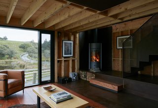 A 24-foot corner window frames a pastoral scene to the north. Steel elements inside the house resonate with the exterior cladding, and both old and new furnishings speak to the historically integrated campus. Enough House sleeps five and includes a full bathroom and kitchen. 