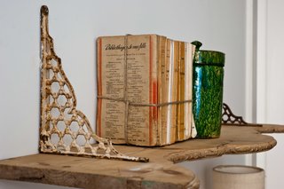 Baixa House Lets Travelers Be at Home in Lisbon - Photo 5 of 10 - Vintage decor characterizes each apartment. The wooden shelves are from a demolition site, and the iron brackets are from Lisbon's Feira da Ladra, a flea market.