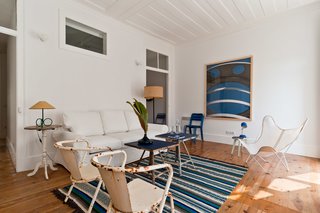 Baixa House Lets Travelers Be at Home in Lisbon - Photo 7 of 10 - "My favorite apartment is Eduardo VII," says Ulecia. "The color scheme is perfect in blue, white, and green. Also it has a little balcony facing Rua dos Fanqueiros, perfect for breakfast in the morning. The bedroom faces the back patio, so it's quiet for sleeping, and has a white wall in front of the window, which brings lots of light inside the room." 