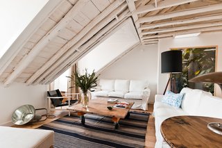 Baixa House Lets Travelers Be at Home in Lisbon - Photo 8 of 10 - Ultramar is the largest apartment in the building with three bedrooms and two bathrooms. The original wooden beams were left exposed and painted white, and the skylights were restored to allow for natural light.