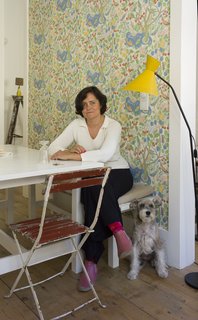 Baixa House Lets Travelers Be at Home in Lisbon - Photo 10 of 10 - Ulecia, pictured here with her dog Lola, strives to make Baixa House a personalized experience from the personally arranged flowers to the well-stocked kitchens in every apartment.