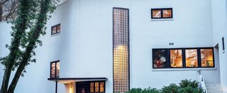 A Curvaceous Connecticut Home Asks $2.6M - Photo 8 of 8 - "The illumination of the house by artificial light is particularly successful at twilight when natural and artificial light unify inside and outside illumination. Then nature and architecture acquire a translucent quality," writes Labatut.