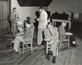 This Book Unearths a Midcentury Personality Study on Architectural Giants - Photo 2 of 13 - The IPAR staff conducts a practice run of the Bingo Test, a "situational procedure involving group interaction." Wallace Hall, the institute's chief deputy, is seated in front.