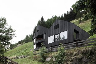 Find Sanctuary in This Chalet in the Italian Alps - Photo 1 of 12 - Only local materials were used to build the chalet, including the larch wood cladding of the exterior, to reinforce the connection between indoors and outdoors.