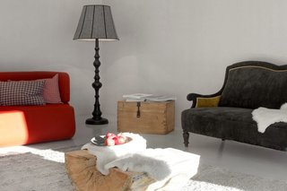 Find Sanctuary in This Chalet in the Italian Alps - Photo 6 of 12 - The main floor holds a spacious living area with a fold-out sofa, reading materials, a flat screen TV, and children's toys.