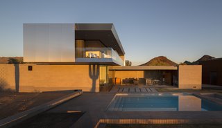 The roof overhangs both reduce solar heat gain and create an upstairs patio, allowing the Staabs to overlook the courtyard or out to the distant mountain range.