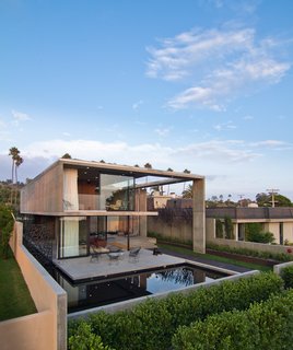 In a neighborhood where houses are much larger and stand in close proximity, the Cresta is shifted toward the back of the lot with around 2,000 square feet of living space placed below grade. 