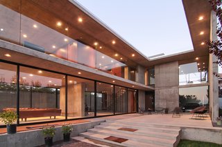 Several factors allow the house to depend nearly wholly on the solar array on the roof for power: windows that completely open for cross ventilation, the thermal mass of concrete, sun shading, and the pool's insulating effect.