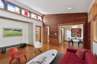 Clerestory windows, outfitted with stained glass in the living room, allow light to bathe nearly every room.