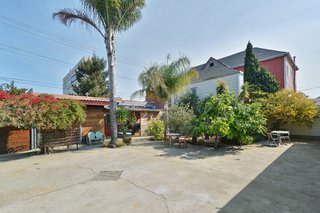 The expansive courtyard is ideal for holding events—or raising chickens, as the previous homeowners did.