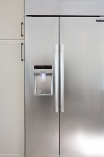 Lewis also installed the 42" Built-In Side-By-Side Refrigerator, which features a SmartSpace™ system that embeds the ice dispenser in the freezer door, freeing up storage space. The adjustable cantilevered shelves add even more capacity and move with a touch of a button. In keeping with the sleek aesthetic of the kitchen, the fridge also has an LED touch control panel. Lewis can use her phone to monitor energy use, delay defrosting, and check on the fridge's performance with Smart Diagnosis.
