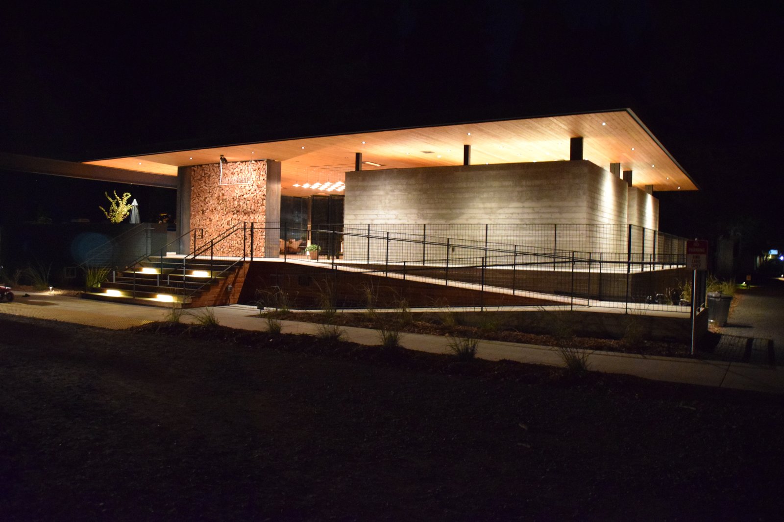 The Clubhouse holds the reception desk, spa-inspired bathrooms and showers, the Canteen, and lounge areas. During inclement weather, a curtain encloses the open pavilion like tent walls.