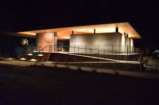 At AutoCamp, Sleep in a Slice of Americana for $225 a Night - Photo 2 of 10 - The Clubhouse holds the reception desk, spa-inspired bathrooms and showers, the Canteen, and lounge areas. During inclement weather, a curtain encloses the open pavilion like tent walls. 