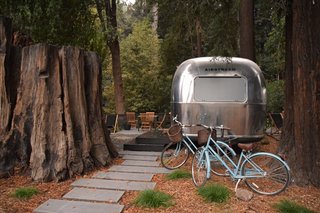 At AutoCamp, Sleep in a Slice of Americana for $225 a Night - Photo 5 of 10 - A thousand-year-old redwood stump abuts an Airstream suite.