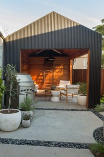 Awkwardly shaped and saddled with a run-down garage, the backyard posed a challenge. Since the city wouldn’t allow for the removal of the garage, Wendi and Lukas decided to convert it into additional living space.