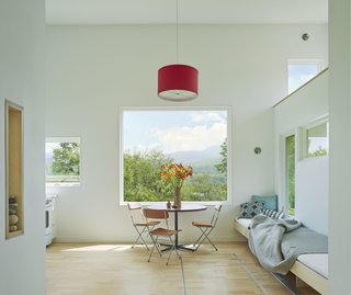A large picture window allows Camel's Hump to hang above the kitchen/work table like a painting. "One of the reasons I love using Marvin is I get great support here in Vermont," says Herrmann. "Marvin does a great job in helping me through a lot of special details, mixing custom things with off-the-shelf windows; we feel like we can push the boundaries."