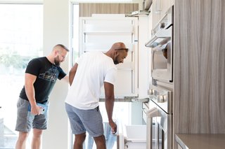 Monogram Modern Home Shows Some Southern Hospitality - Photo 2 of 8 - Guests get a feel for the fully integrated refrigerator, which offers customizable climate control in three zones and a convertible lower drawer.